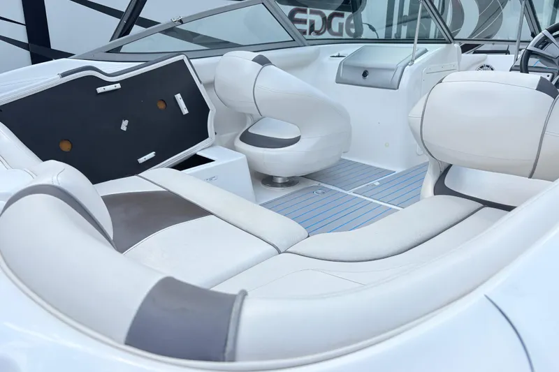Slide: The Image of 2014 Yamaha SX190 boat interior with white seating and modern design. - 12