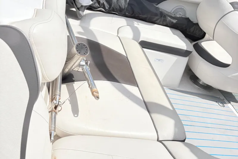 Slide: The Image of Interior of a 2014 Yamaha SX190 boat with white and black seating. - 9