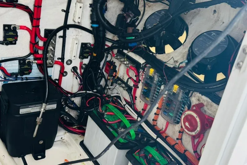 Slide: The Image of Cockpit of 2005 Carrera Boats 32 with Simrad navigation system and steering wheel. - 6