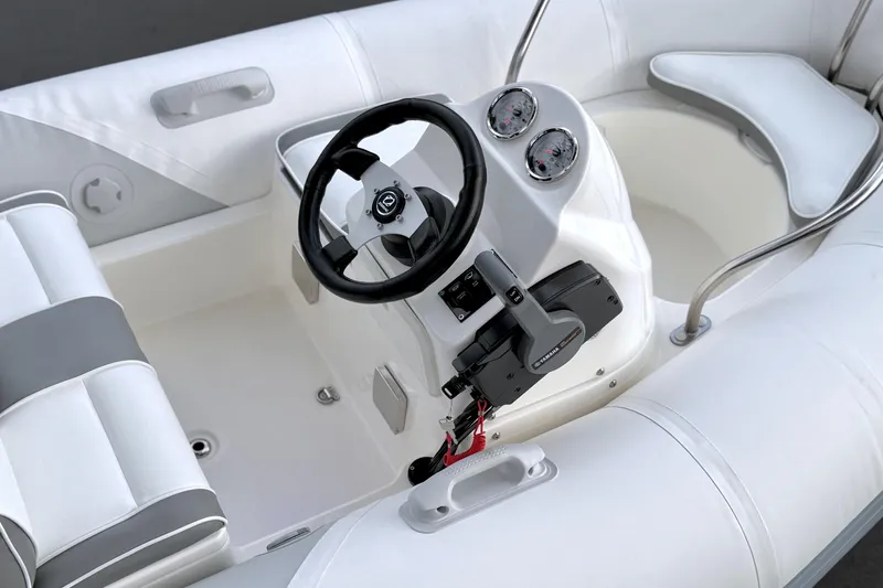 Slide: The Image of 2003 Zodiac Yachtline 340DL boat interior with steering wheel and seating. - 15