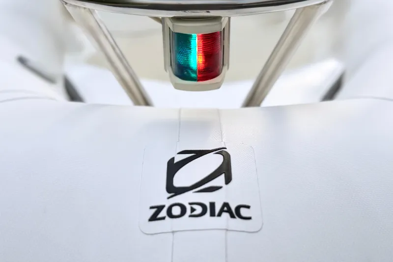 Slide: The Image of 2003 Zodiac Yachtline 340DL boat with navigation light and logo detail. - 4