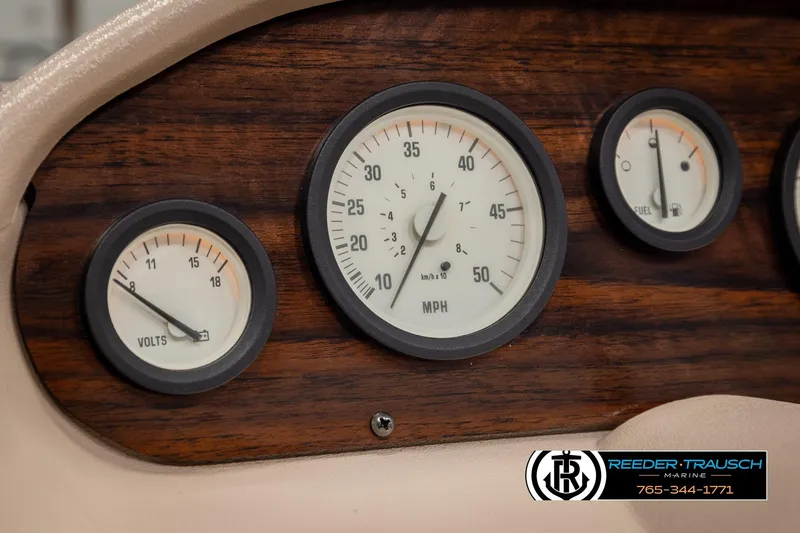 Slide: The Image of Dashboard of a 1998 Lowe LS 2220 boat with voltmeter and speedometer gauges. - 27