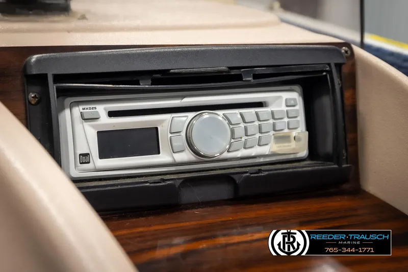 Slide: The Image of 1998 Lowe LS 2220 boat stereo system, Dual MXD25 model, in dashboard installation. - 30