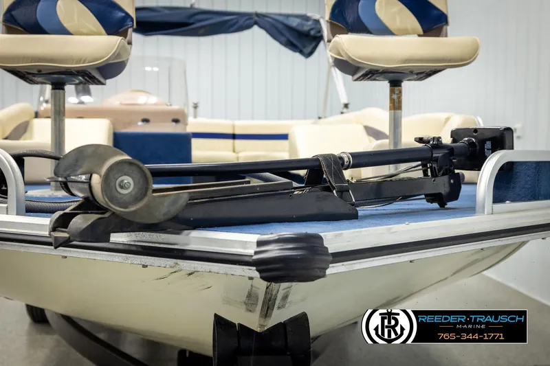 Slide: The Image of 1998 Lowe LS 2220 boat interior with motor and seating, Reeder-Trausch Marine logo visible. - 37