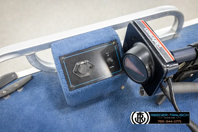 Slide: The Image of 1998 Lowe LS 2220 boat control panel with Johnson throttle and tilt switch. - 38