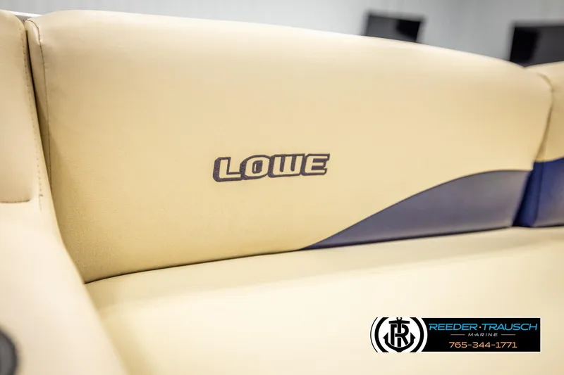 Slide: The Image of Beige Lowe LS 2220 boat seat with logo, 1998 model, Reeder-Trausch Marine branding. - 40