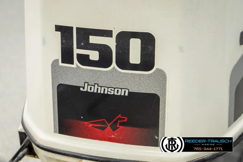 Slide: The Image of Close-up of a Johnson 150 outboard motor on a 1998 Lowe LS 2220 boat. - 44