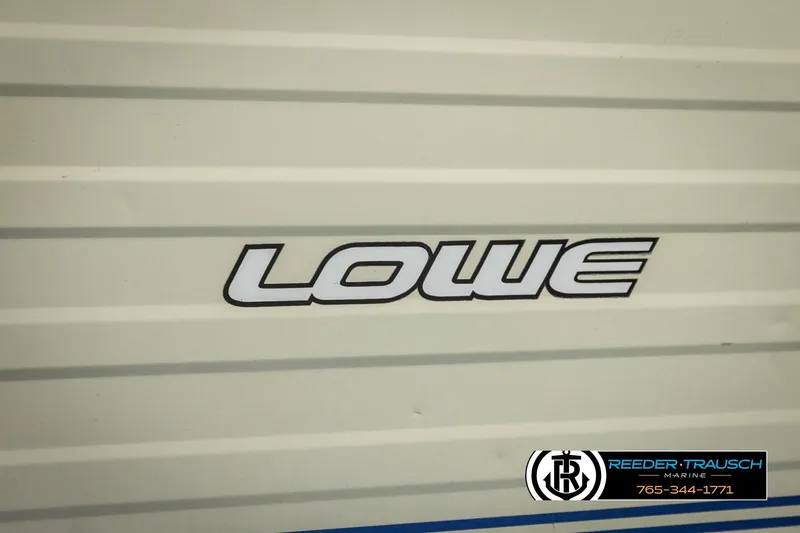 Slide: The Image of 1998 Lowe LS 2220 boat logo on beige background, Reeder-Trausch Marine contact info. - 47