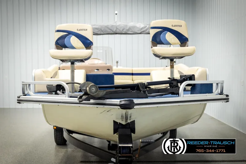Slide: The Image of 1998 Lowe LS 2220 boat with dual seats, displayed indoors at Reeder-Trausch Marine. - 8
