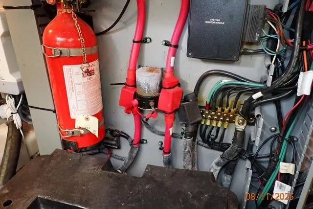 Slide: The Image of Electrical system and fire extinguisher in 2003 Sea Ray 460 Sundancer boat. - 11