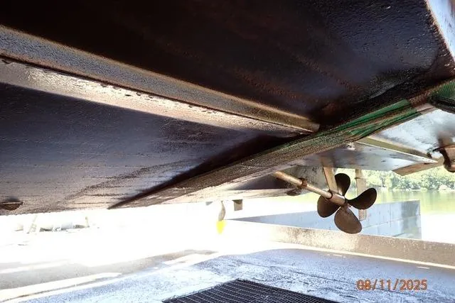 Slide: The Image of Underside view of 2003 Sea Ray 460 Sundancer boat with visible propeller. - 15