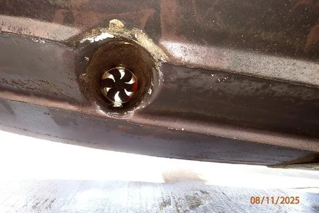 Slide: The Image of Close-up of a 2003 Sea Ray 460 Sundancer hull with visible thruster. - 17