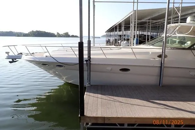 Slide: The Image of 2003 Sea Ray 460 Sundancer yacht docked at marina on a sunny day. - 21