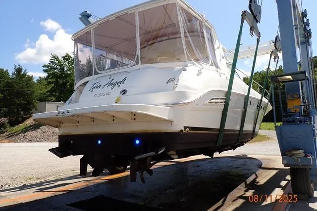 Slide: The Image of 2003 Sea Ray 460 Sundancer yacht on lift, rear view, sunny day. - 3