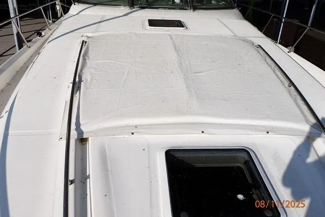Slide: The Image of 2003 Sea Ray 460 Sundancer boat deck with sunroof and railing. - 37