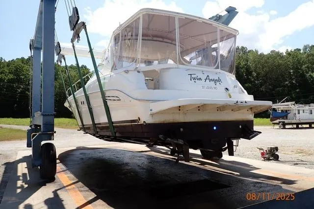 Slide: The Image of 2003 Sea Ray 460 Sundancer yacht in dry dock, named "Twin Angel." - 4