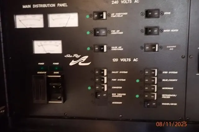 Slide: The Image of Main distribution panel of 2003 Sea Ray 460 Sundancer with voltage controls and switches. - 40