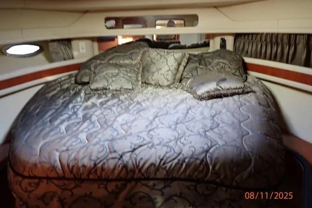 Slide: The Image of Luxurious bedroom interior of 2003 Sea Ray 460 Sundancer yacht with elegant bedding. - 44