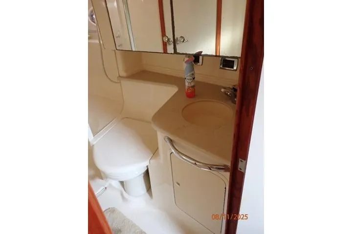 Slide: The Image of Bathroom interior of 2003 Sea Ray 460 Sundancer yacht, featuring sink and toilet. - 47