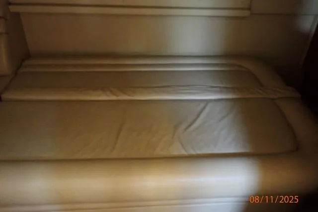 Slide: The Image of Interior cabin bed of 2003 Sea Ray 460 Sundancer yacht, beige upholstery. - 50