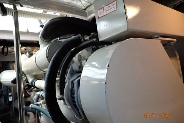 Slide: The Image of Engine room of 2003 Sea Ray 460 Sundancer yacht, showcasing mechanical components. - 55