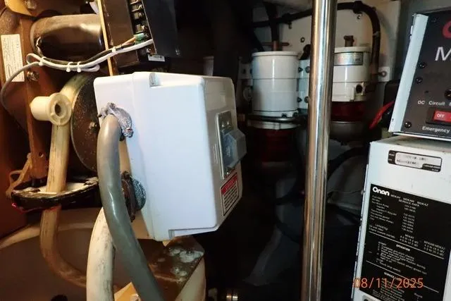 Slide: The Image of Engine room of 2003 Sea Ray 460 Sundancer with electrical components and wiring. - 9