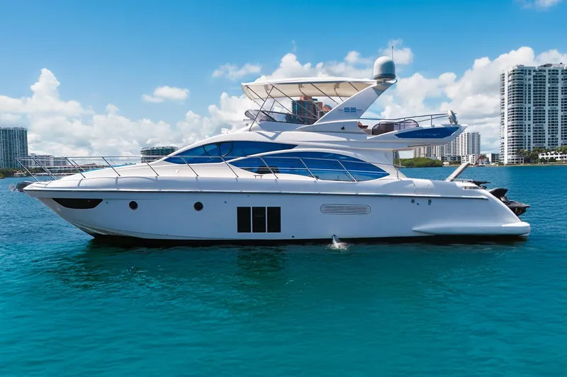 The Image of Luxury 2012 Azimut Fly 53 yacht on clear blue water, city skyline in background. - 1
