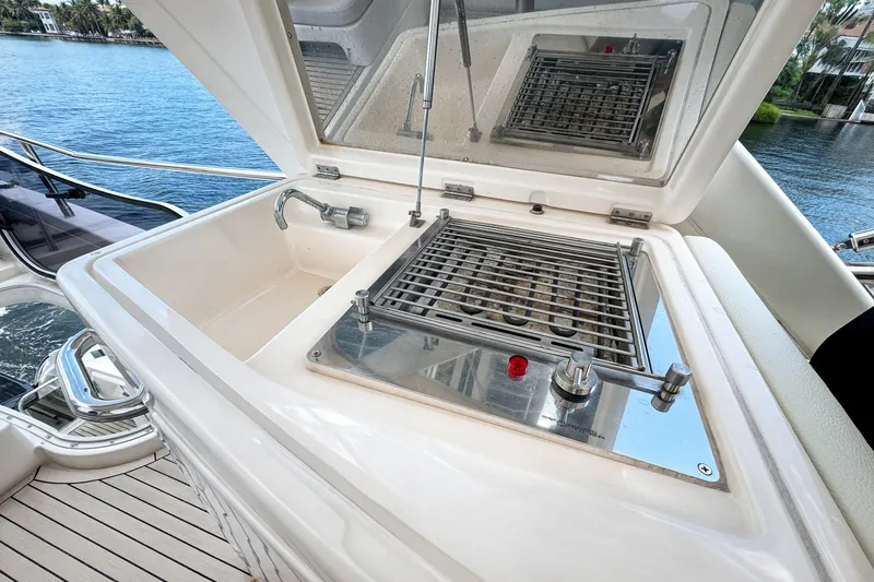 Slide: The Image of Outdoor grill and sink on 2012 Azimut Fly 53 yacht, overlooking serene water. - 17
