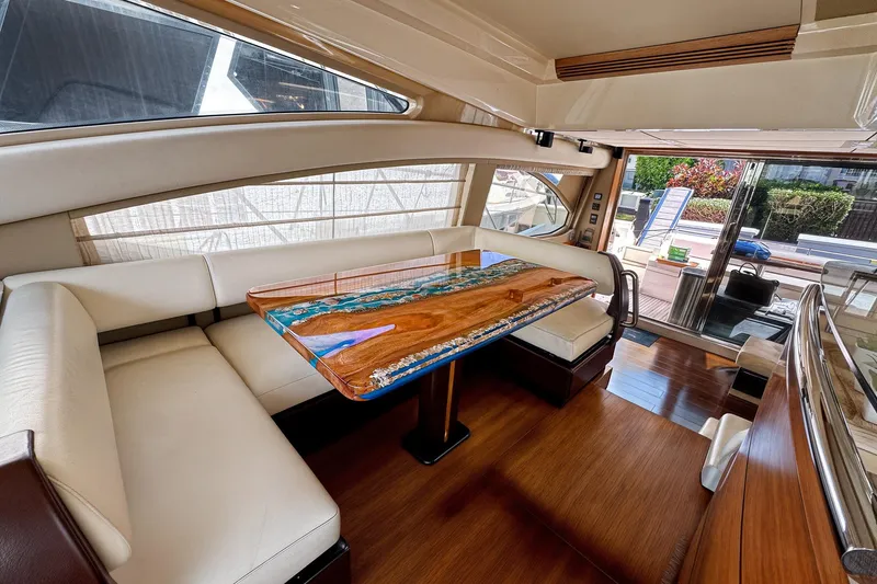 Slide: The Image of Luxurious interior of 2012 Azimut Fly 53 yacht with elegant seating and custom table. - 22