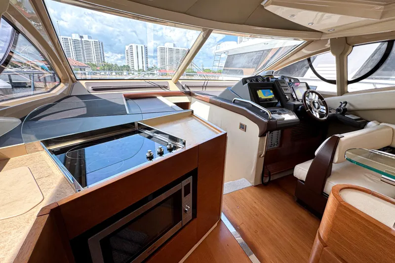 Slide: The Image of Luxurious interior of 2012 Azimut Fly 53 yacht with modern helm and kitchen area. - 25