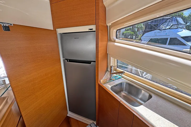 Slide: The Image of Modern kitchen area in 2012 Azimut Fly 53 yacht with stainless steel fridge and sink. - 26