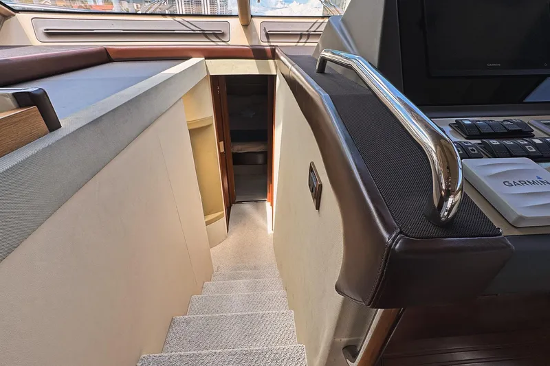 Slide: The Image of Interior view of 2012 Azimut Fly 53 yacht, featuring stairs and navigation equipment. - 28