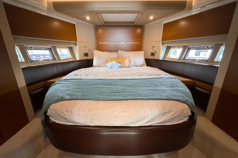 Slide: The Image of Luxurious bedroom interior of 2012 Azimut Fly 53 yacht with elegant bedding and natural light. - 32