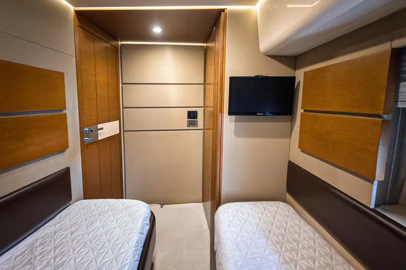 Slide: The Image of Luxurious cabin interior of 2012 Azimut Fly 53 yacht with twin beds and wall-mounted TV. - 35