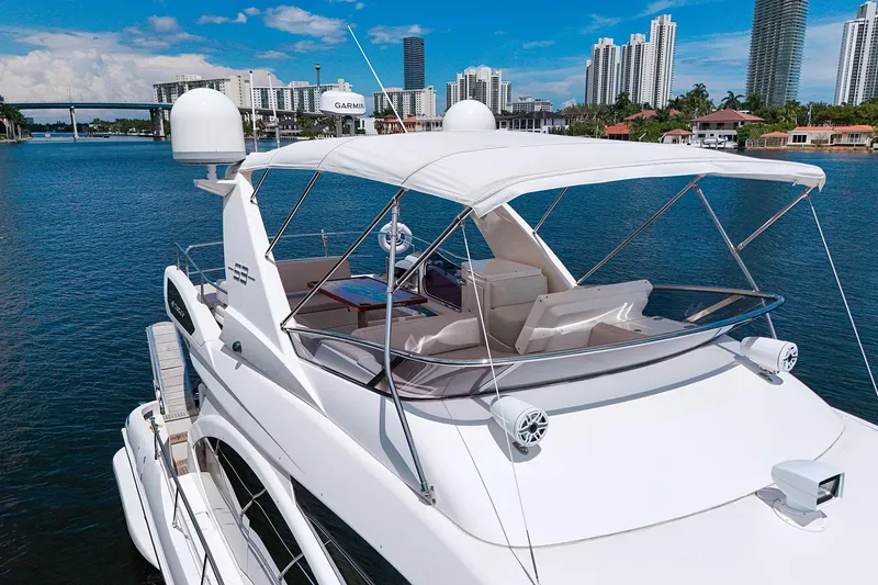 Slide: The Image of Azimut Fly 53 yacht, 2012 model, cruising near city skyline and waterfront homes. - 36