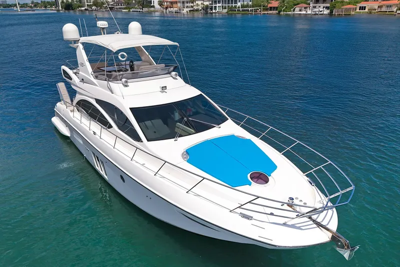 Slide: The Image of Luxury 2012 Azimut Fly 53 yacht cruising on clear blue water. - 4