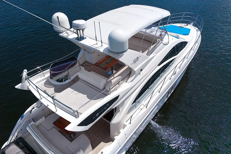 Slide: The Image of Luxurious 2012 Azimut Fly 53 yacht cruising on open water, aerial view. - 9