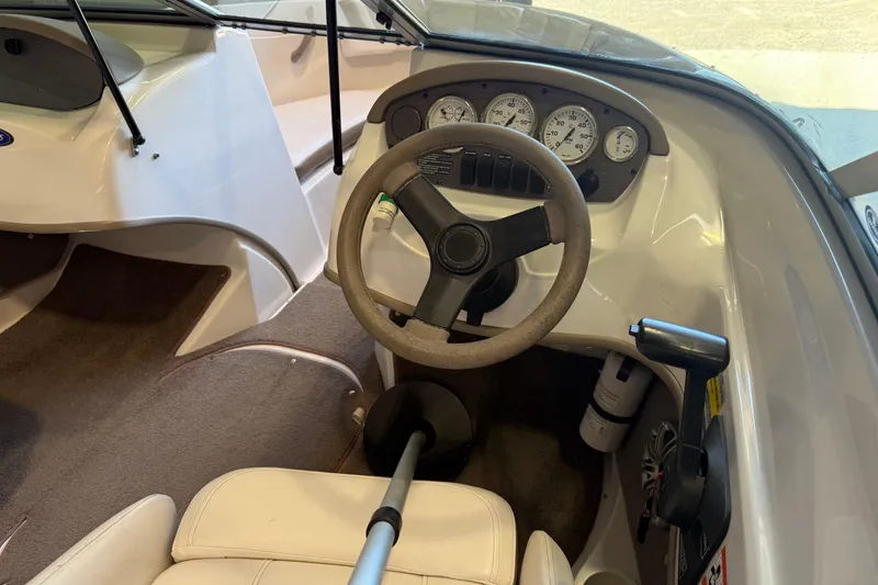 Slide: The Image of 2008 Four Winns H183FS boat cockpit with steering wheel and instrument panel. - 4