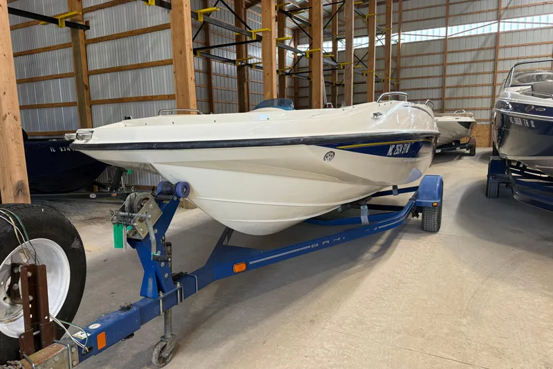 Slide: The Image of 2008 Four Winns H183FS boat on trailer in storage facility. - 6