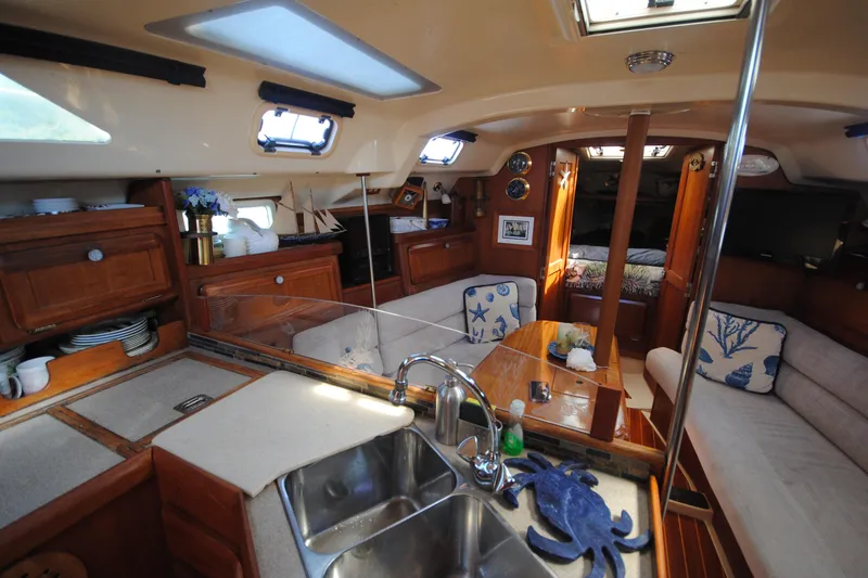Slide: The Image of Interior of 1993 Hunter Legend 35.5 sailboat with cozy seating and nautical decor. - 12