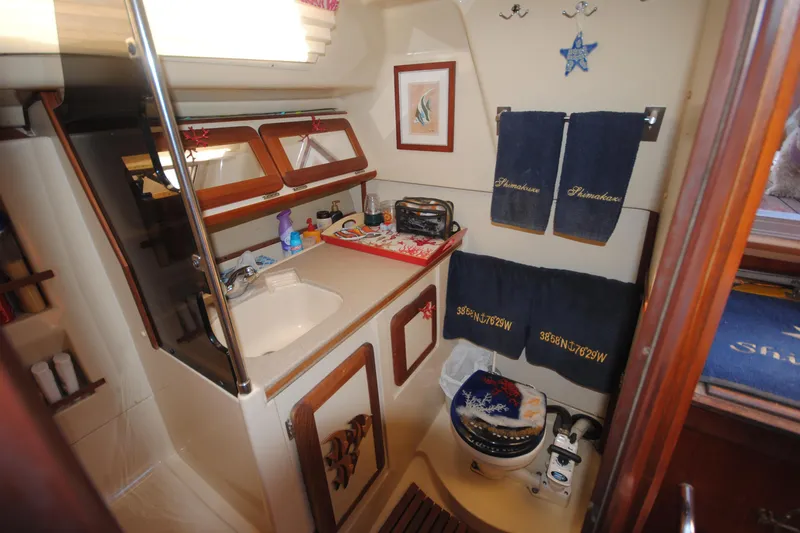 Slide: The Image of Bathroom interior of 1993 Hunter Legend 35.5 yacht with nautical decor. - 17