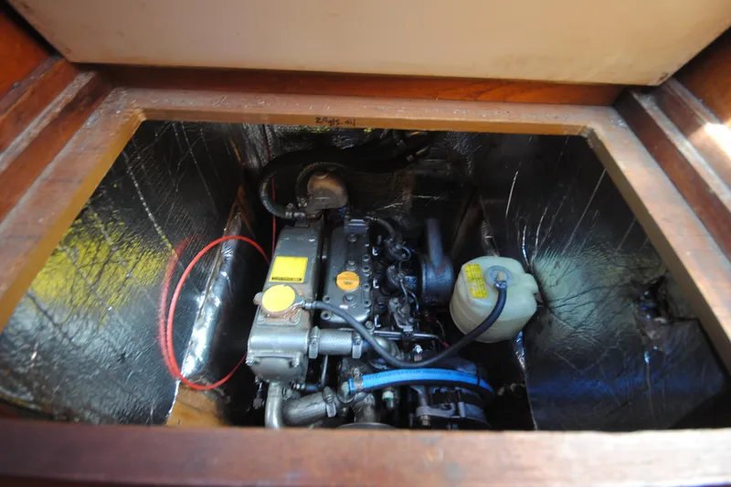 Slide: The Image of Engine compartment of 1993 Hunter Legend 35.5 sailboat, showcasing mechanical components. - 19