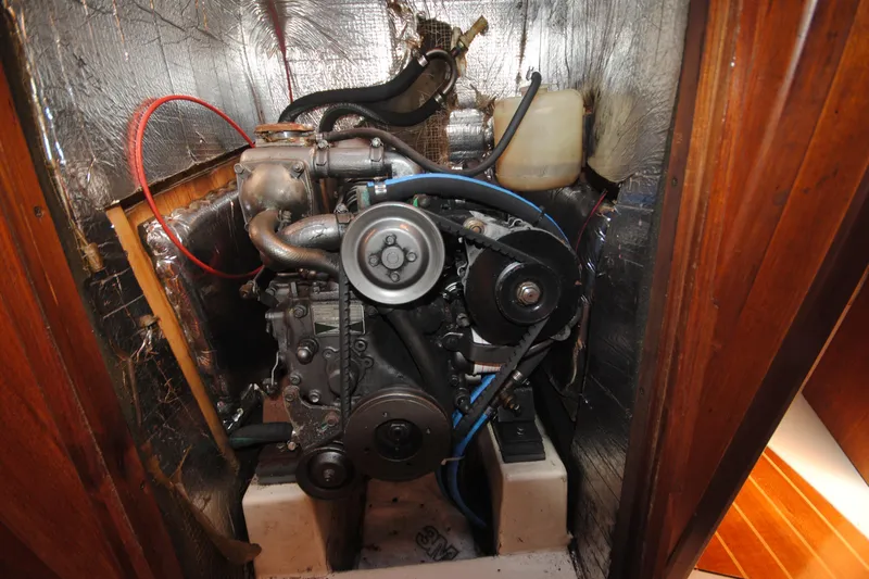Slide: The Image of Engine compartment of a 1993 Hunter Legend 35.5 sailboat, showcasing mechanical components. - 20