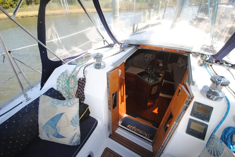 Slide: The Image of Interior view of 1993 Hunter Legend 35.5 sailboat, featuring cozy cabin and nautical decor. - 6