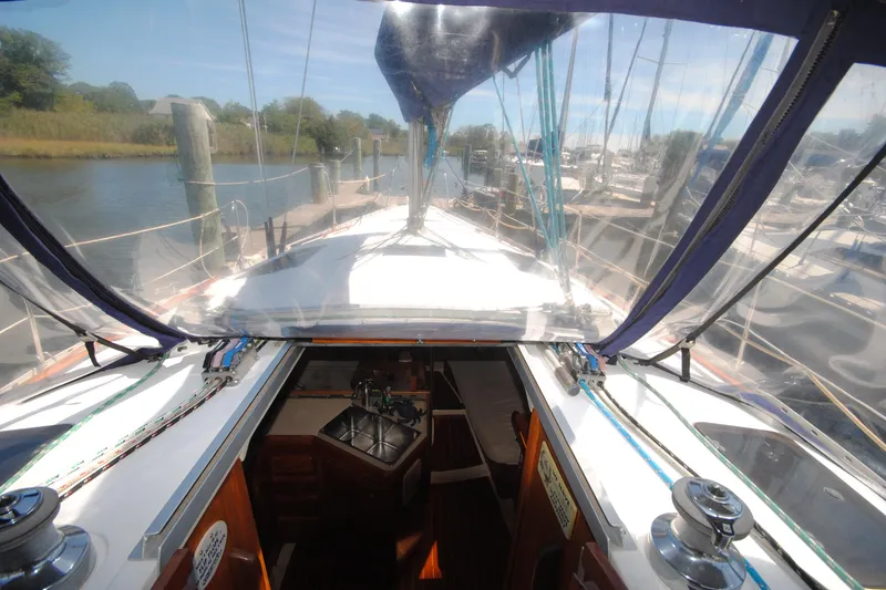 Slide: The Image of Interior view of 1993 Hunter Legend 35.5 sailboat docked at a marina. - 7