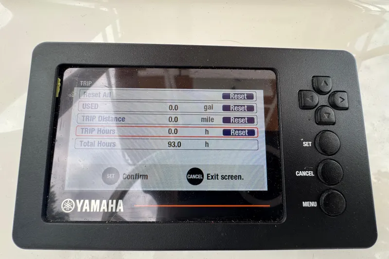Slide: The Image of Yamaha display on 2023 Edgewater 208CC showing trip and total hours. - 22