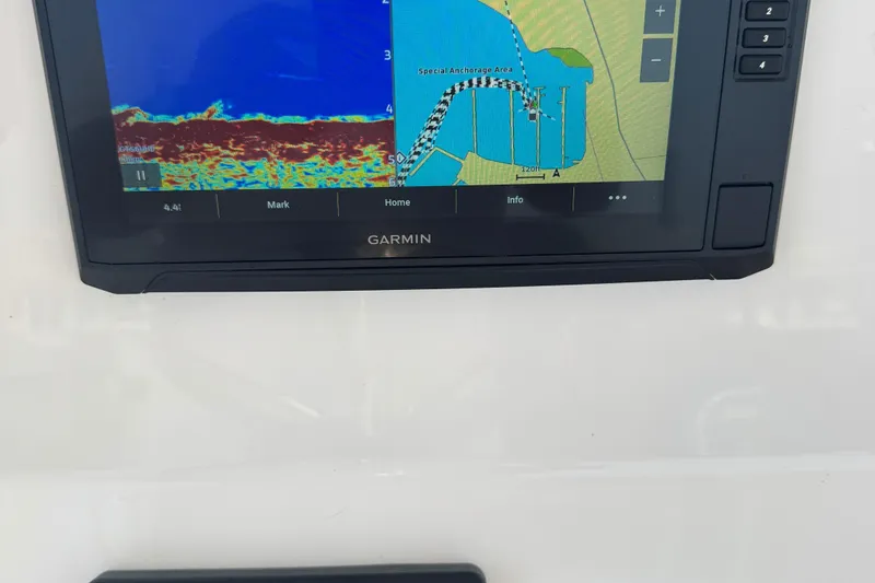 Slide: The Image of Garmin navigation display on 2023 Edgewater 208CC boat, showing sonar and map data. - 31