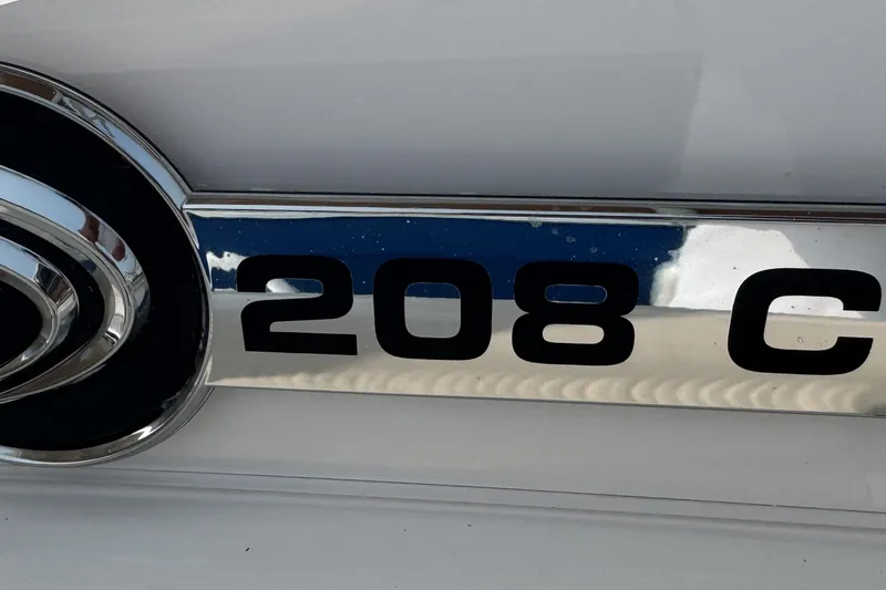 Slide: The Image of Close-up of 2023 Edgewater 208CC boat emblem on a sleek surface. - 33
