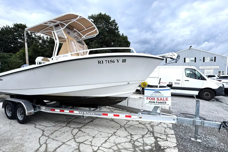 Slide: The Image of 2023 Edgewater 208CC boat on trailer, for sale at marina. - 5
