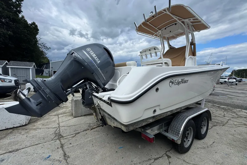 Slide: The Image of 2023 Edgewater 208CC boat with Yamaha outboard motor on a trailer. - 7